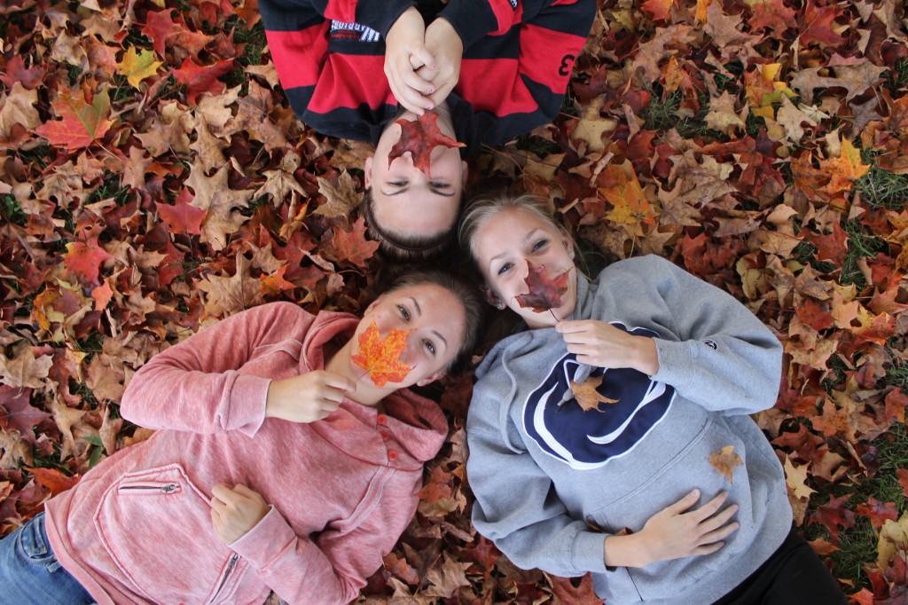 Danielle Dungee, Audra Organetti, and Tanya Lorah enjoy fallen leaves of Autumm. Photo Credit / Brook Wadle