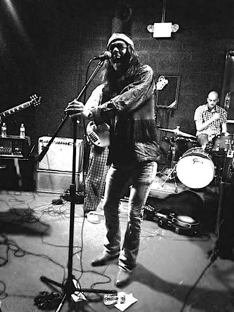 Lead singer of Quimby Mountain Band Jesse Bardwell performs at Shawnee Brewery. Photo Credit / Frank Bixler