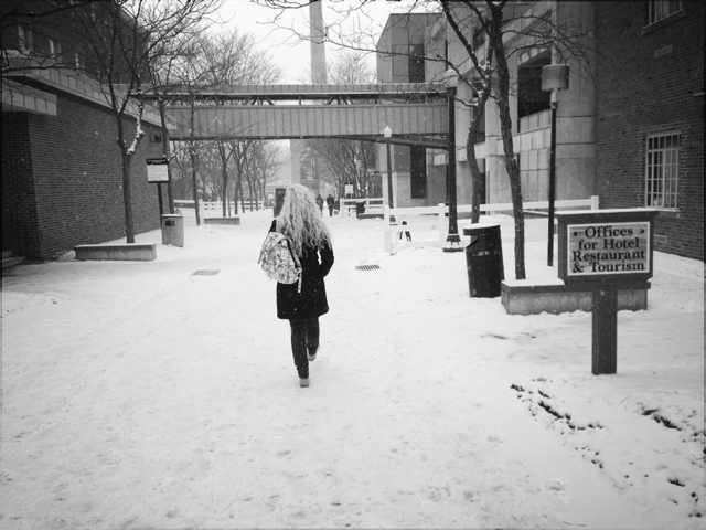 ESU Senior, Brook Wadle, braves the East Stroudsburg University campus  during harsh weather conditions. Photo Credit / Valentina Caval