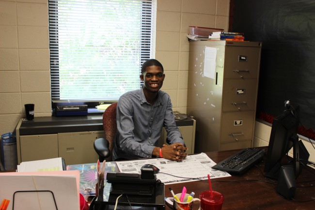 Student Senate President Drew Johnson sitting at his desk. Photo Credit / Jamie Reese