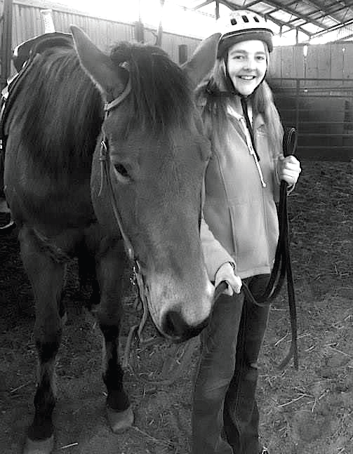 ESU senior Paige Ocker with her riding partner Zipper at Mountain View Farms in Kunkeltown. Photo Credit / Briana Magistro