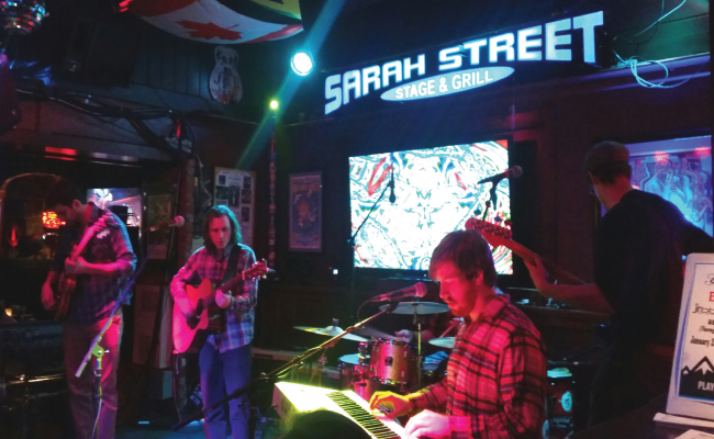 Hoochie Coochie Men rockin' the Sarah Street stage on February 6. Photo Credit / Amanda Schreck