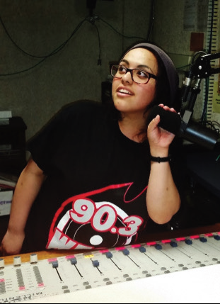 DJ Sara G. in the WESS radio studio. Photo Credit / Amanda Schreck
