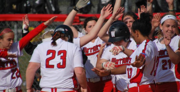 Dungee’s teammates celebrate her home run by doing the dab. Photo Credit / Ronald Hanaki