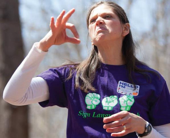 ESU's Dr. Miller showing her sign language skills. Photo Credit / ESU Sign Language Instagram