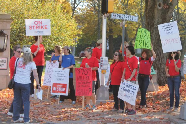 Faculty on the picket line lead by Dr. Leigh Smith chant “What do we want? Contract! When do we want it? Now!” Photo credit / Kathleen Kraemer