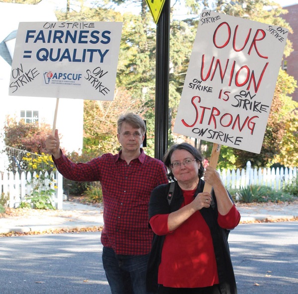 Dr. Peter Pruim and Dr. Patricia Kennedy picketing on day one of the strike. Photo Credit / Kathleen Kraemer