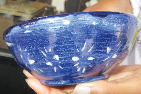 Student shows off crafted bowl. Photo Credit / Edita Bardhi