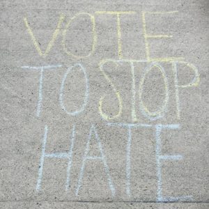 “Vote to Stop Hate.” Sidewalk chalk message outside SciTech on election day, Nov. 8, 2016. Photo Credit / Rebecca Rue