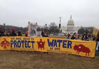 Protesters take a stand to protect water. Photo Courtesy / Cynthia Leenerts