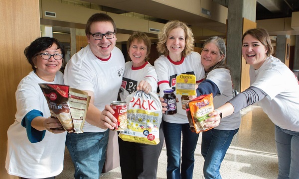 Photo Courtesy / Brenda Friday Staff and faculty help collect non-perishables for ESU’s “Canniversary” event.