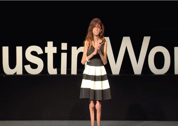 Screen Grab From “How Do YOU Define Yourself?” Motivational Speaker Lizzie Velasquez talks in front of a full crowd.