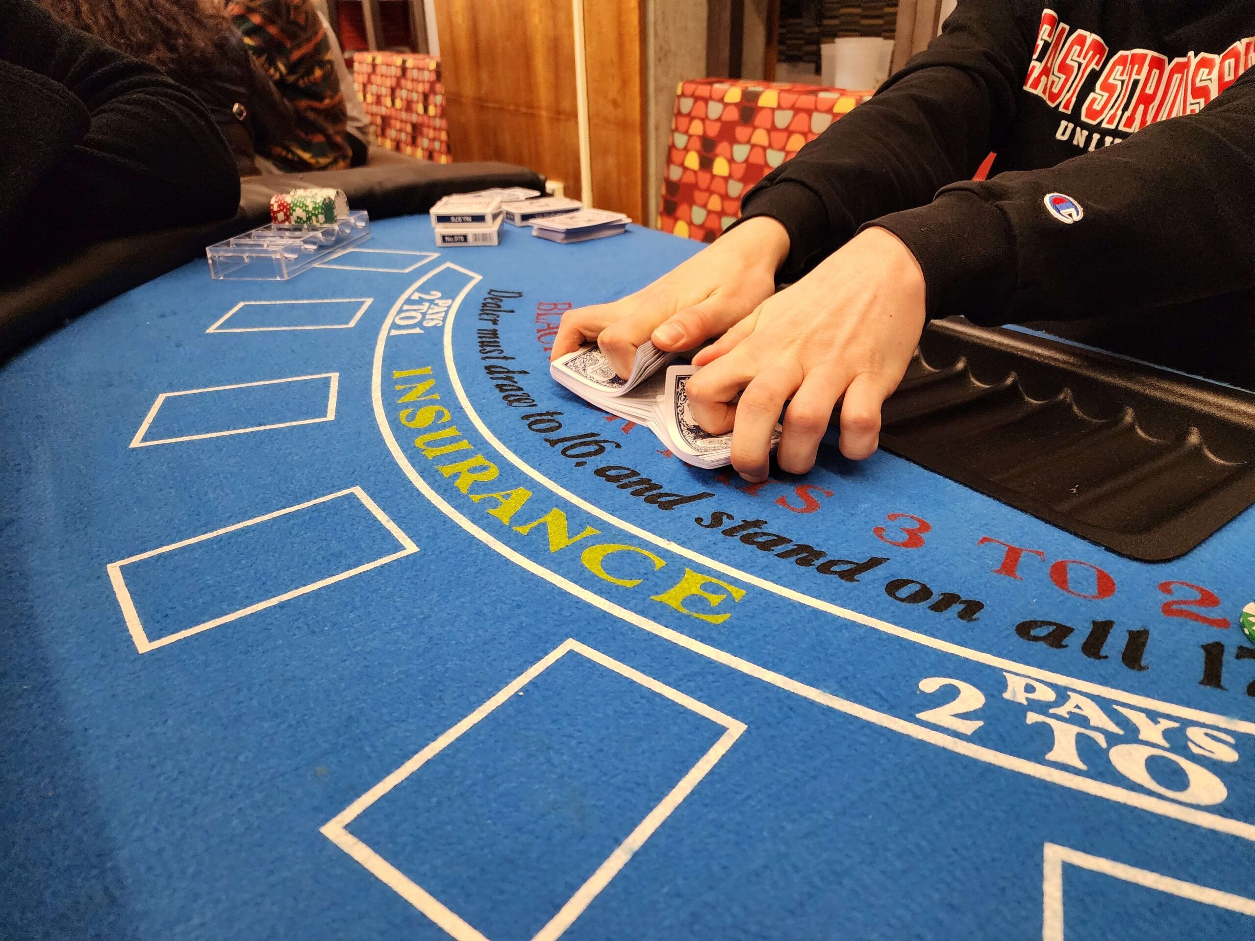 Cards being shuffled on blackjack table