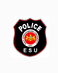 A black badge with a red circle in the middle