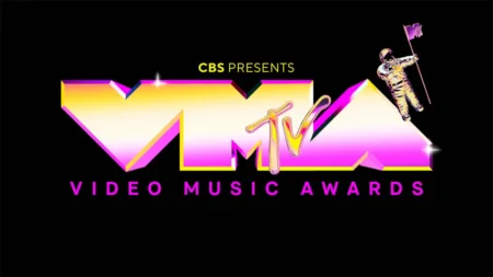 The letters "V, M, and A" in yellow and pink font